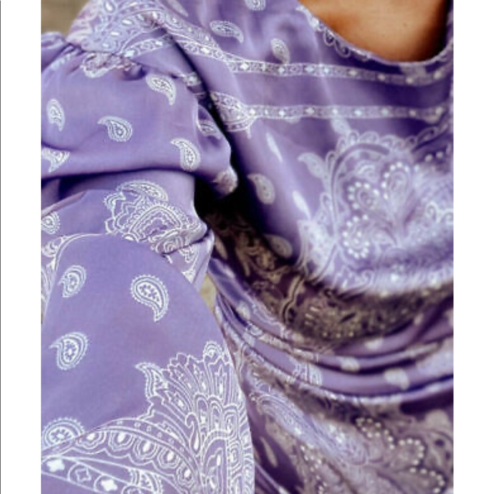 Zara’s scarf print purple dress.
